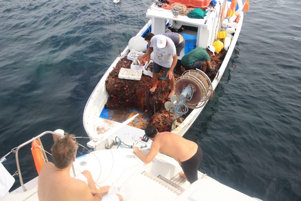 Buying fresh fish from the local fisherman of Vulcano for the evening dinner 